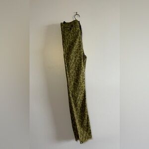 A comfortable pair of pants, "In olive green with black (leopard) spots."